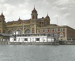 United States Immigration Station building on Ellis Island. A ferry named "Laura" is docked in front of the building. c. 1900 United States Immigration Station building on Ellis Island. A ferry named "Laura" is docked in front of the building. c. 1900