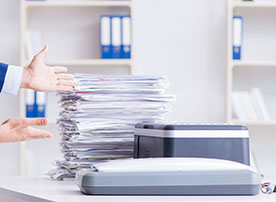 Learn more about Imaging and Microfilming Image. Pile of paper and scanner