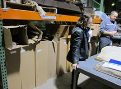 Learn more about our records management services Image. Staff assessing canal reservoir maps