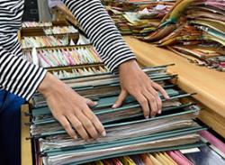 Learn more about the role of a Records Management Officer Image. Filing records